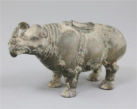 A rare Chinese archaic bronze ritual rhinoceros wine vessel, Zun, early Western Han dynasty, 206 B.C. - 9 A.D. 11.8cm high, 21cm long